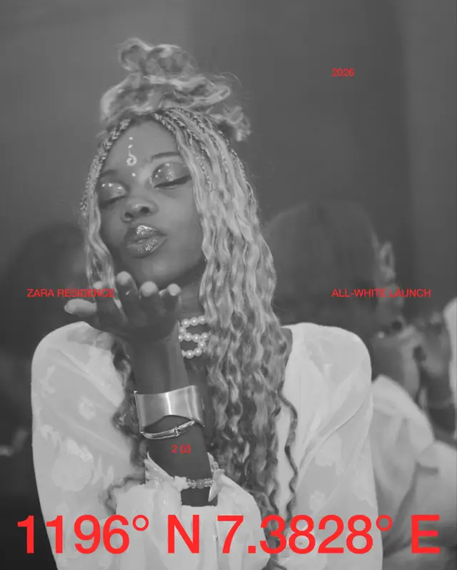 A resident with long braids, in white