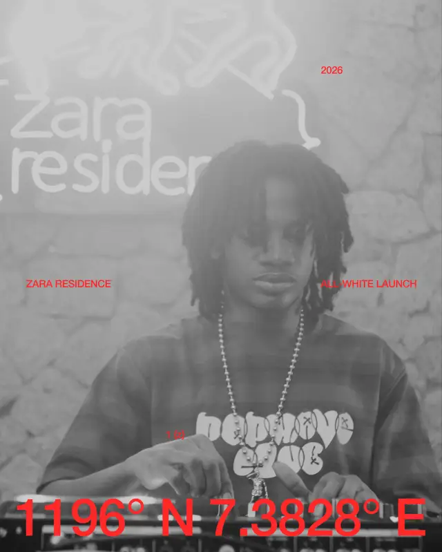 A guest with dreads and a chain at the backdrop