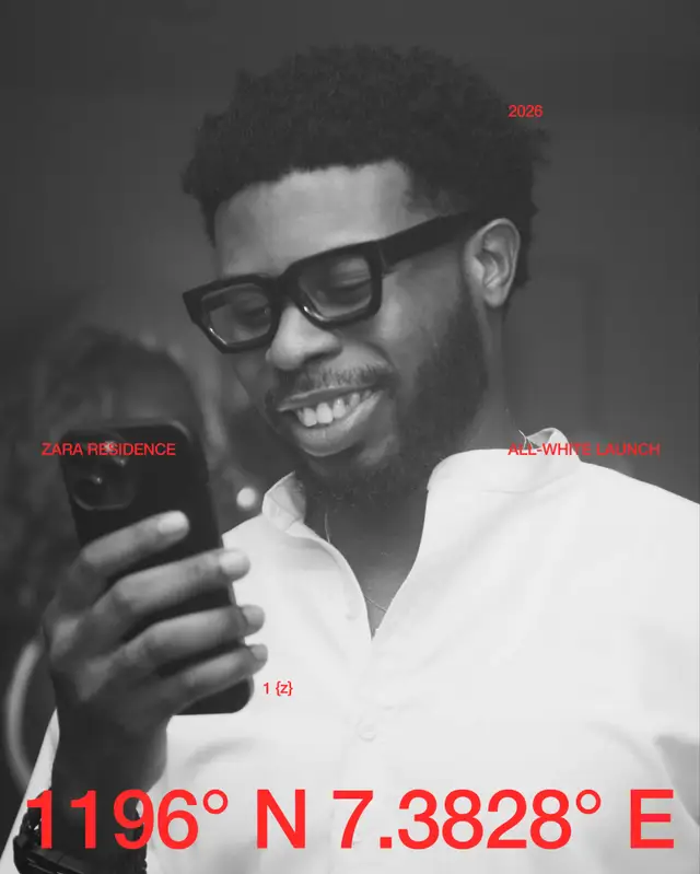A guest laughing in a white shirt